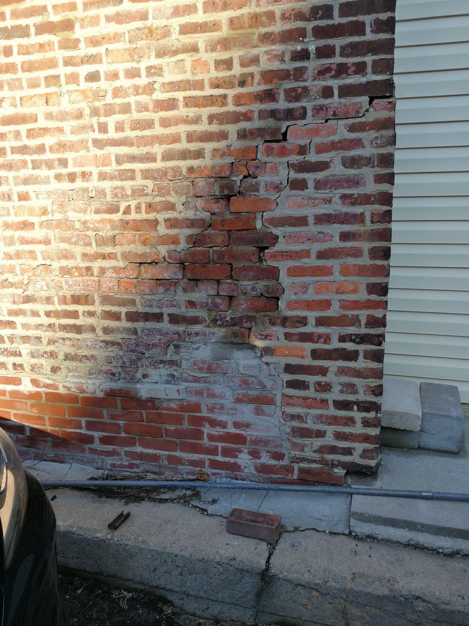 Existing masonry wall condition photographed near 59 Henry Street.